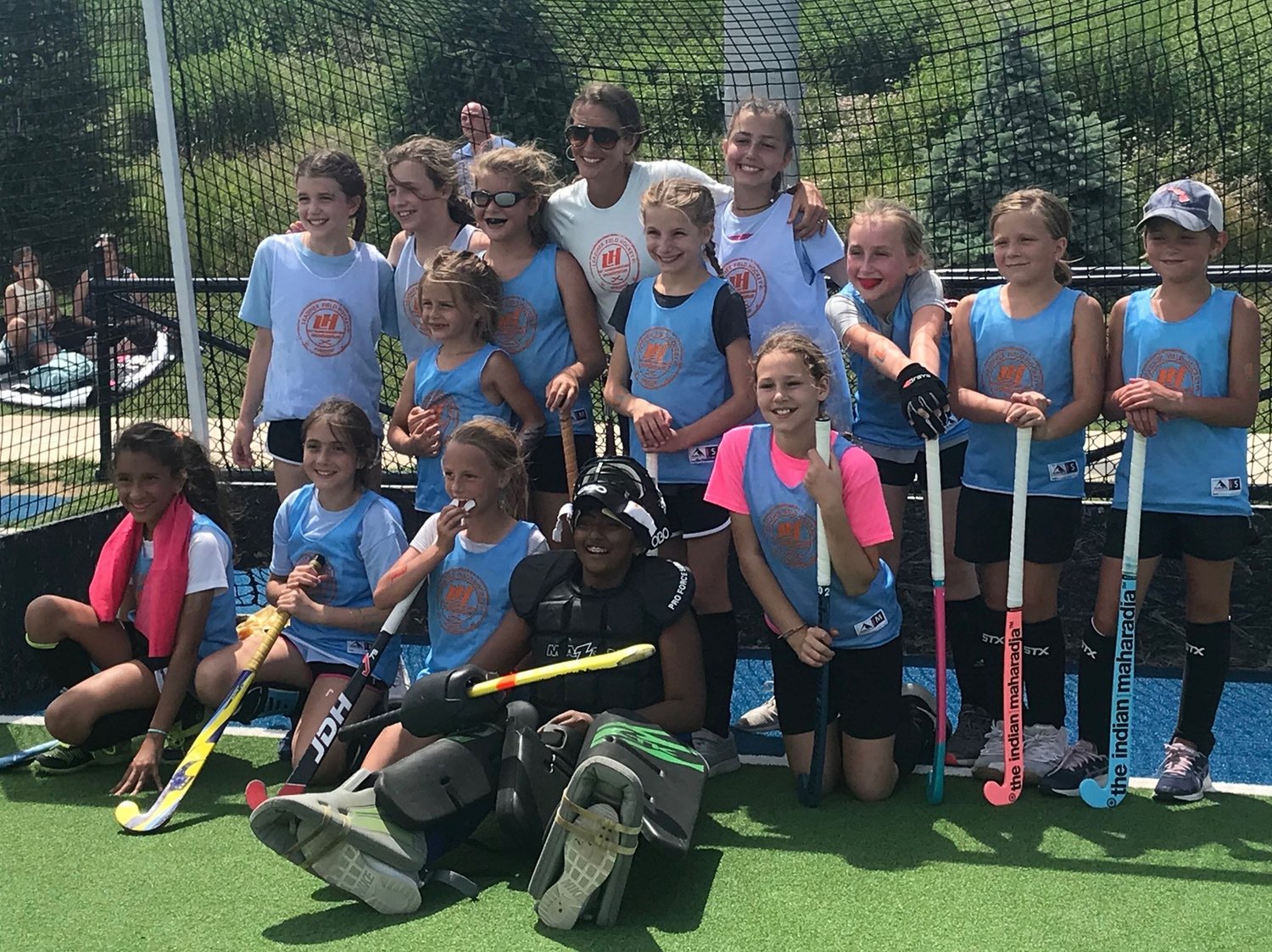Melisa and a group of LeadHer players together on the field